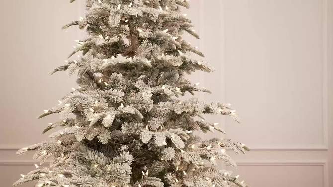 4.5ft Puleo Pre-Lit Flocked Slim Aspen Fir Artificial Christmas Tree Clear Lights, 2 of 5, play video