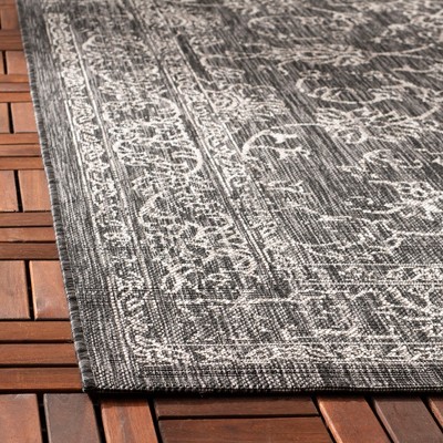Safavieh Courtyard Black and Ivory Synthetic Indoor/Outdoor Area Rug