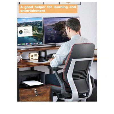 Person using a brown wood-finish desk with dual monitors