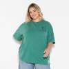 Adult Peanuts Charlie & Lucy Boyfriend Short Sleeve Graphic T-Shirt- Green - 2 of 4