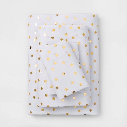 white and gold polka dot bedding