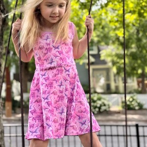 The Pink Picket Fence Suzie Dino Summer Twirl Dress for Girls – Sleeveless Play Dress – Hand-Painted Dinosaur Print - 1 of 4