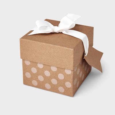 Present, green & white polka dot ribbon, brown wrapping paper