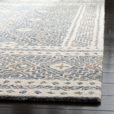 Ivory and Blue Handmade Wool Tufted Area Rug, 5' x 8'