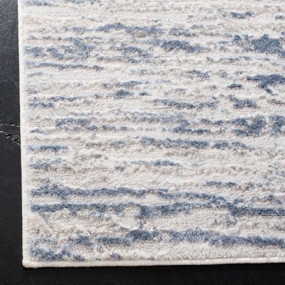 Ivory and Blue Abstract 8' x 10' Stain-Resistant Area Rug