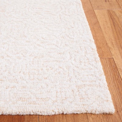 Ivory Hand Tufted Wool Rectangular 8' x 10' Area Rug