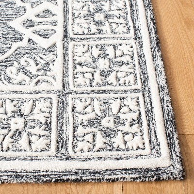 Handmade Black Wool 4' x 6' Tufted Area Rug