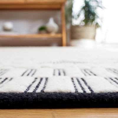 Ivory and Black Geometric Wool 3' x 5' Area Rug