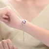 Perfect for teens and young adults, this White Gold-Plated Adjustable Bracelet features a ribbon wrapped around a heart for a meaningful touch. - 2 of 4