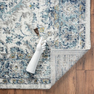 Ivory and Blue Oriental Synthetic 8' x 10' Area Rug