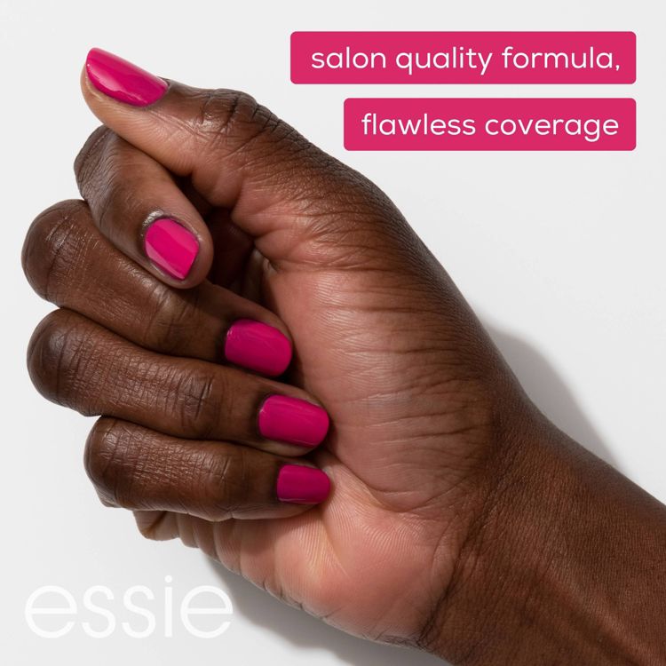 A hand with nails painted in bright pink colored nail polish, with text reading "salon quality formula, flawless coverage" and "essie" in the corner.