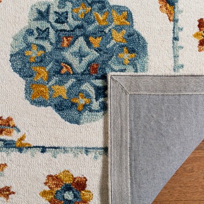 Handmade Blue Floral Wool 5' x 8' Tufted Area Rug