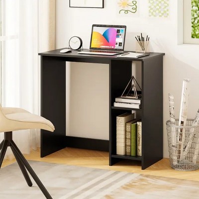 Desk with laptop and stationery in home office setup