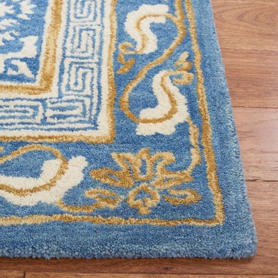 Blue and Ivory Hand Tufted Wool Area Rug 5' x 8'