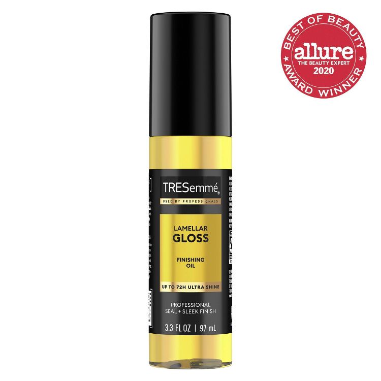 A bottle of TRESemmé Lamellar Gloss Finishing Oil with a black cap and yellow label, featuring text "UP TO 72H ULTRA SHINE" and "3.3 FL OZ / 97 mL," alongside a "Best of Beauty Award Winner 2020" badge.
