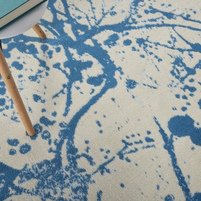 Ivory and Blue Abstract Synthetic 4' x 6' Easy-Care Area Rug