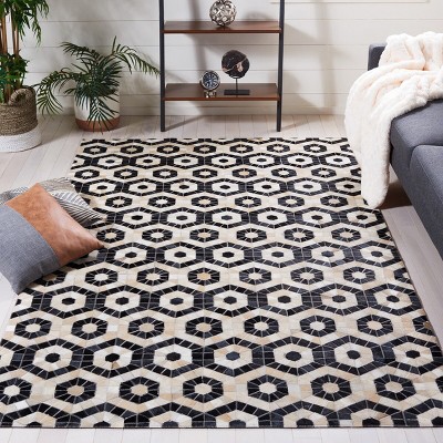 Handmade Black and Beige Geometric Cowhide Area Rug
