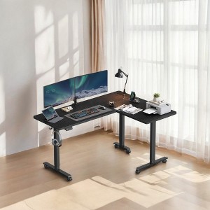 Shaped Electric Standing Desk, 63 x 47.2 inches. A height - adjustable corner desk with power outlets and 2 memory buttons. - 1 of 4
