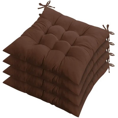 Stacked brown tufted chair seat cushions with corner ties