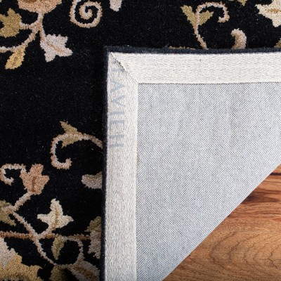 Elegant Heritage Black Wool 7'6" x 9'6" Hand-Tufted Area Rug