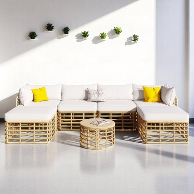 7-Piece Modular Wicker Sofa Set with Removable Cushions, Adjustable Feet, and Round Coffee Table for Outdoor Spaces