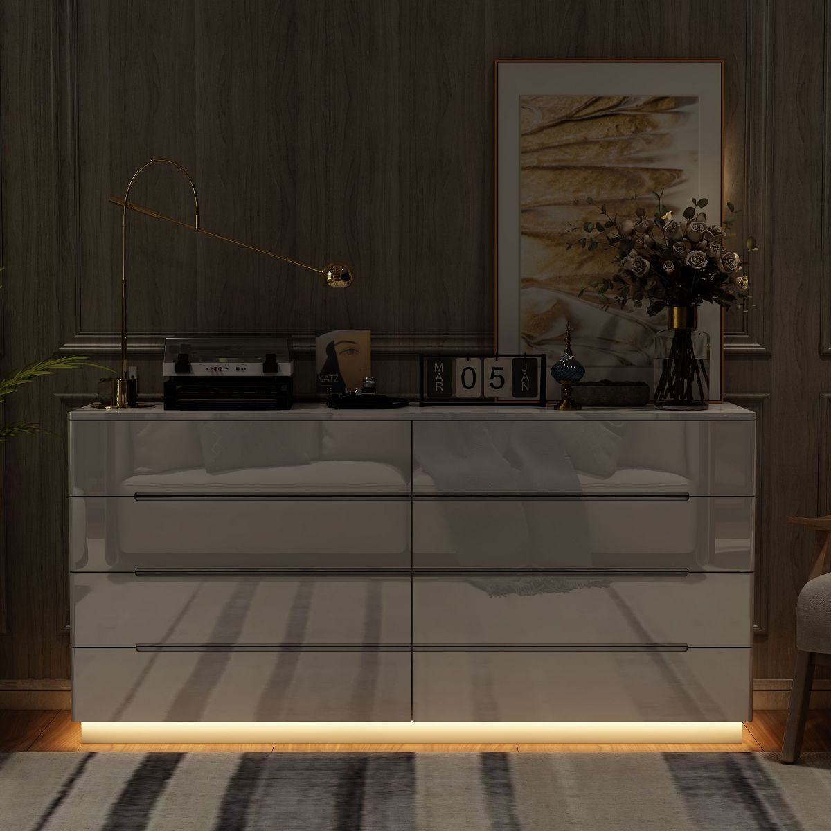 White high-gloss dresser in a darker room with warm bottom lighting