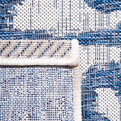 Ivory and Navy Animal Print Indoor/Outdoor Rug