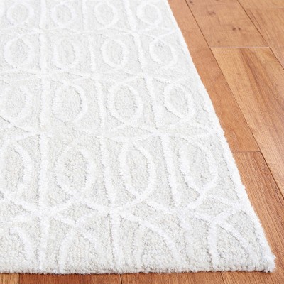 Beige and Ivory Tufted Wool and Viscose 6' x 9' Area Rug