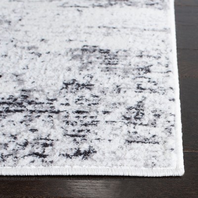 Ivory and Grey Abstract 4' x 6' Synthetic Area Rug