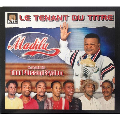 Madilu & Son Orchestre Tout Puissant System - Le Tenant Du Titre (CD)