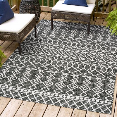 4' x 6' Black and Ivory Synthetic Diamond Pattern Area Rug