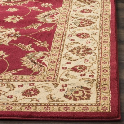 Red and Ivory 4' x 6' Synthetic Safavid Style Area Rug