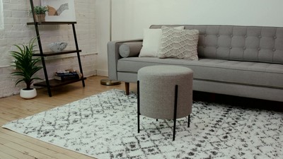 Gray Round Upholstered Ottoman with Black Metal Base