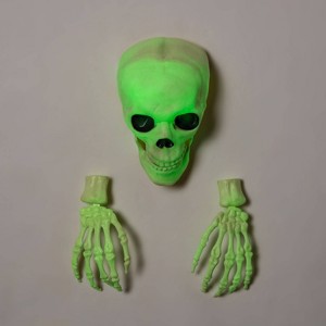Glow in the Dark Skull with Hands Halloween Decorative Prop - Hyde and EEK! Boutique™: Antique Finish, Indoor/Outdoor Use - 1 of 3