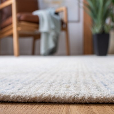 Ivory and Beige Abstract Handmade Wool Area Rug, 6' x 9'