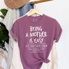 Simply Sage Market Women's Being A Mother Is Easy Short Sleeve Garment Dyed Graphic Tee - 3 of 3