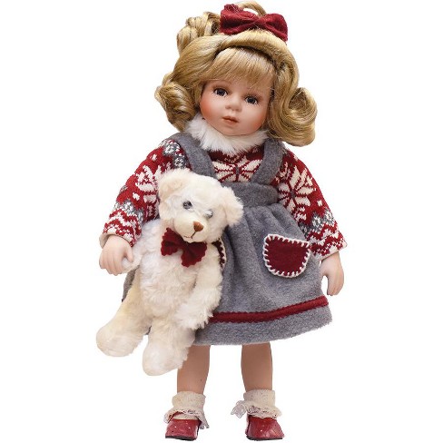 porcelain doll with teddy bear