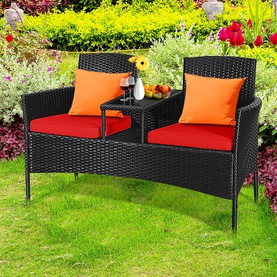 Compact Black Wicker Patio Loveseat with Red Cushions and Glass Table