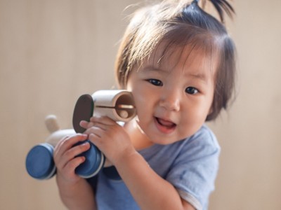 Natural Rubberwood Push and Pull Puppy Toy with Blue Wheels