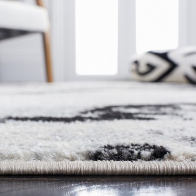 Ivory Boho-Chic Hand-Knotted Synthetic Area Rug