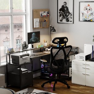 L-shaped computer desk with power outlets, featuring dual monitor mounts, ideal for home offices and gaming rooms as a gaming desk. - 1 of 4