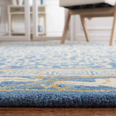 Blue and Ivory Hand Tufted Wool Area Rug 5' x 8'