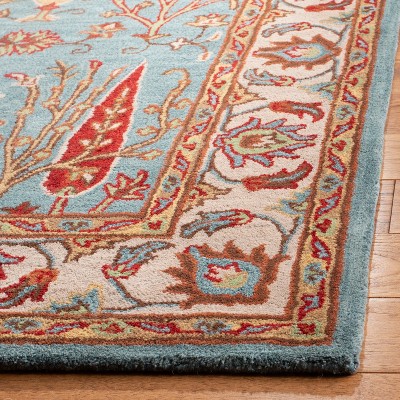 Handmade Blue and Ivory Wool 4' x 6' Area Rug