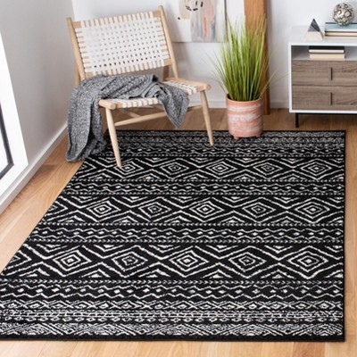 Black and Ivory Geometric Synthetic Rectangular Area Rug, 5'3" x 7'6"