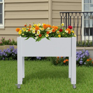 Elevated garden bed with wheels for outdoor plant cultivation - 1 of 4