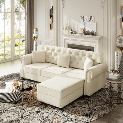Cream-colored sectional with one ottoman in a bright living room