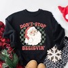 Simply Sage Market Women's Graphic Sweatshirt Don't Stop Believin' Santa Checkered - 3 of 4