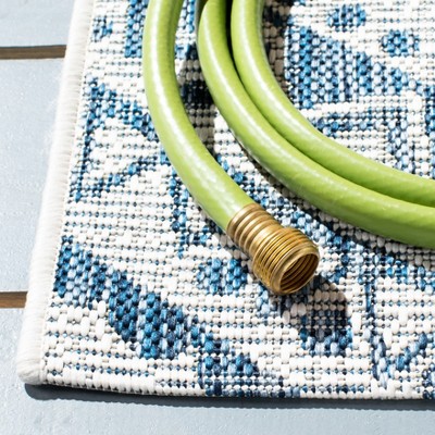Ivory and Navy Geometric Round Synthetic Area Rug