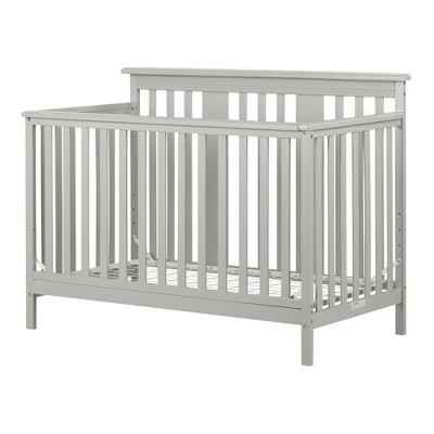 crib with adjustable rail