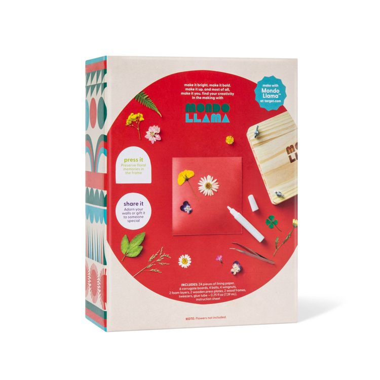 Craft kit box featuring floral pressing tools, a wooden press, and various accessories with colorful illustrations on the side.
